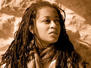 Woman dreadlocks rock wall scarf - studio portrait free wallpaper