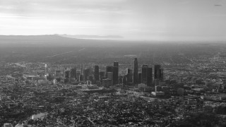 City mountains plane flying black - photo of a city free wallpaper