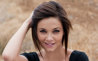 Woman black shirt smiling holding - holding free wallpaper