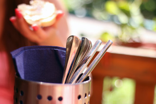 Woman holding cup silverware spoons - product photo free wallpaper