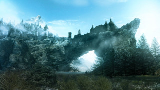 Large rock formation bridge forest - a forest in the background free wallpaper