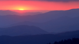 Sunset mountain range red sky 7 - a sunset over a mountain range free wallpaper