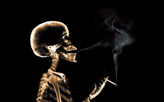 Skeleton smoking cigarette dark night - his mouth free wallpaper