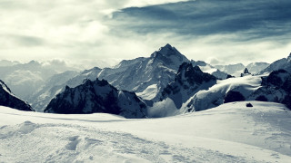 Person on skis snowy mountain 2 - a snowy mountain free wallpaper