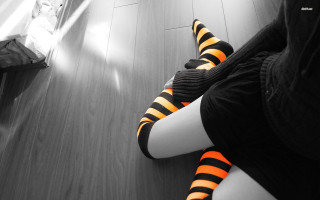 Person striped socks sitting floor - high contrast free wallpaper
