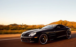 Black sports car desert sunset - a road in the desert free wallpaper