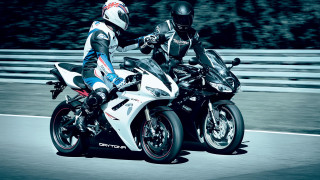 Motorcycles riding road fence trees - two person free wallpaper