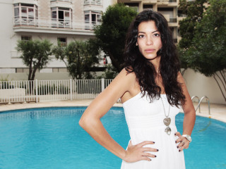 Woman white dress pool building - a building in the background and trees free wallpaper