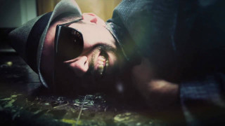 Man hat sunglasses laying head - video art free wallpaper