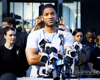 Man microphones crowd hands up - a screenshot free wallpaper