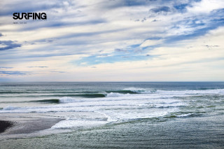 Surfer walking ocean cloudy sky - a surfer free wallpaper