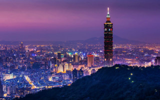 City skyline night tall tower - a purple sky above free wallpaper