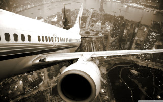 Jetliner night city lights flying 2 - international typographic style free wallpaper
