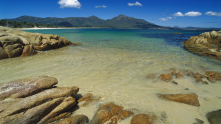 Beach rocks water mountain clouds - rock and water free wallpaper