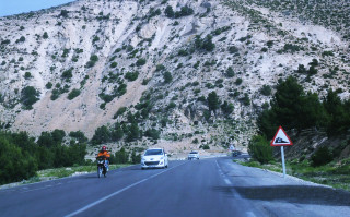 Man bike mountain road car - a mountain side free wallpaper