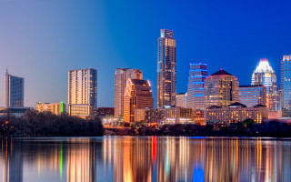 City skyline lake nighttime lights - the water and buildings free wallpaper