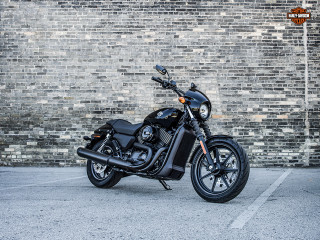 Black motorcycle brick wall parking 3 - a brick wall behind free wallpaper