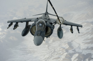 Fighter jet flying mountains snow - 100mm free wallpaper