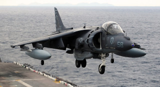 Fighter jet ocean ship landing 2 - a ship in the ocean free wallpaper