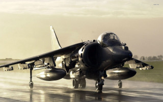 Jet plane runway rain backlit - a jet plane free wallpaper