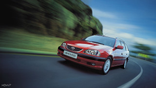 Red car driving road green 2 - lush free wallpaper