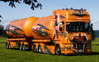 Large orange truck parked field - matte finish free wallpaper for desktop
