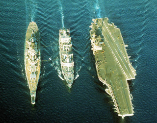 Three ships in the water - the water near each other free wallpaper
