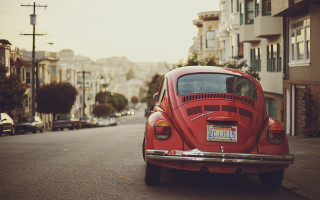 Red car parked road building 5 - car free wallpaper