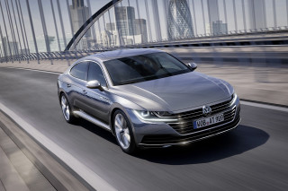 Silver volkswagen arteus driving city - panfuturism free wallpaper