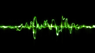 Green wave sound black background - a green light in the middle free wallpaper