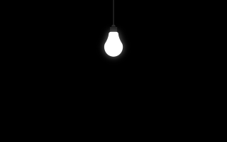 Light bulb hanging ceiling dark - side and a light free wallpaper