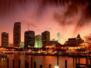 City skyline night water dock 5 - a dock in the foreground free wallpaper