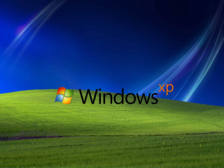 Windows xp logo green field - blue sky in the background free wallpaper