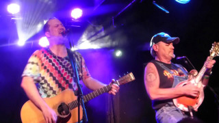 Two men playing guitars on - the other free wallpaper
