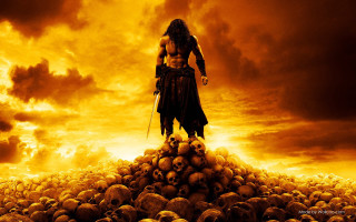 Man standing pile skulls field - cloudy free wallpaper