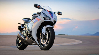 Motorcycle parked road mountain range 6 - ray free wallpaper