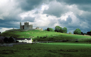 Castle hill greenfield cloudy sky - sheep free wallpaper