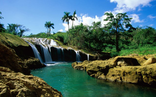 Waterfall forest rocks lake beach - a body of water below free wallpaper