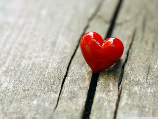 Heart shaped object wooden surface - a wooden surface free wallpaper