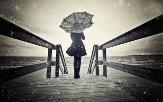 Woman pier umbrella rain ocean - winter free wallpaper
