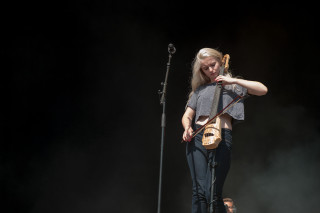 Woman stage guitar microphone performance 2 - a stage free wallpaper