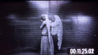 Tv screen angel statue clock - a tv screen free wallpaper