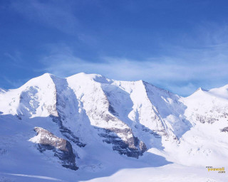 Person skis snow mountain range - near free wallpaper