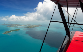 Tropical island plane window ocean - tropical free wallpaper