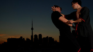 Two men dancing city skyline - action scene free wallpaper