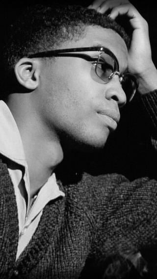 Man glasses sweater leaning wall - 1 9 6 0 s free wallpaper