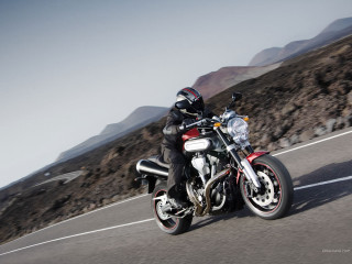 Man motorcycle road mountain range - a road next free wallpaper