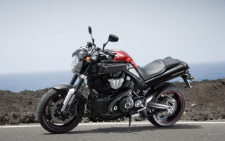 Motorcycle parked ocean road rocks - cafer bater free wallpaper