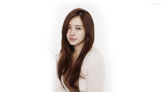 Woman long hair posing white - a white background behind her free wallpaper