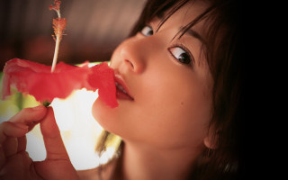 Woman holding flower mouth looking - her mouth free wallpaper